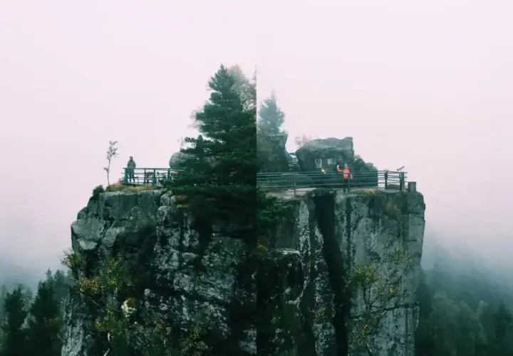 Widok na skalne miasto, gdzie karłów atrakcje przyciągają turystów. Mgła otula szczyty, tworząc mistyczną atmosferę.