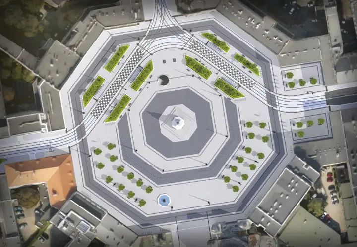 Nowoczesny plac wolności w Łodzi z zielonymi wyspami, szachownicą i torami tramwajowymi.