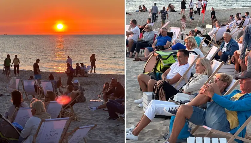 Zachód słońca nad morzem w Międzyzdrojach, ludzie siedzą na leżakach na plaży.
